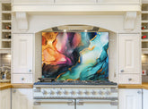 May include: A white kitchen range with a glass backsplash featuring an abstract design of blue, green, purple, and gold paint. The backsplash is a modern and stylish addition to the kitchen.