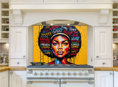 May include: A white kitchen with a black and yellow stove and a colorful art piece above the stove. The art piece features a portrait of a woman with a colorful afro and words like 'Queen', 'Happy', 'Love', 'Soul', and 'Spiritual' written around her.