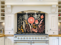 May include: A white kitchen with a black floral patterned backsplash behind a white range with six burner stovetop and two ovens. The backsplash features pink, orange, and yellow flowers and leaves on a black background.