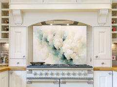 May include: A white kitchen with a stainless steel range hood and a white range with six burners. The backsplash is a large abstract painting with white and blue colors.