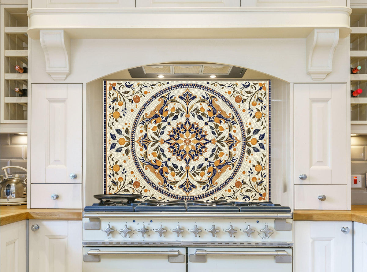 May include: A white kitchen with a white range hood and a white range with six burner knobs. The backsplash is a cream colored tile with a blue and gold floral design.