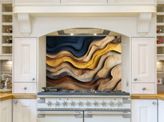 May include: A white kitchen with a stove and a backsplash featuring a colorful abstract design of wavy lines in shades of brown, yellow, and blue.