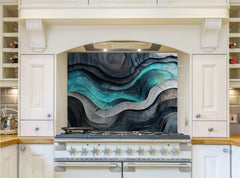 May include: A white kitchen range with a black and teal abstract design backsplash. The backsplash features a wavy pattern with a 3D effect. The range has a black top with six silver knobs and a white oven door.