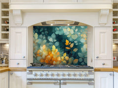 May include: A white kitchen with a range hood and a stainless steel range. The backsplash behind the range is a teal and yellow floral design. The kitchen cabinets are white with silver hardware.