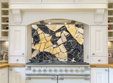 Intricate Mosaic Artwork Featuring Honey-Colored And Charcoal Shapes
