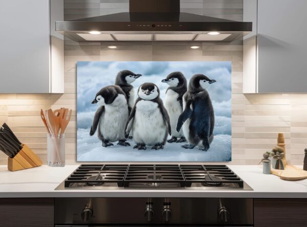 Five Baby Penguins Playfully Stand On Snowy Ice - Image 4